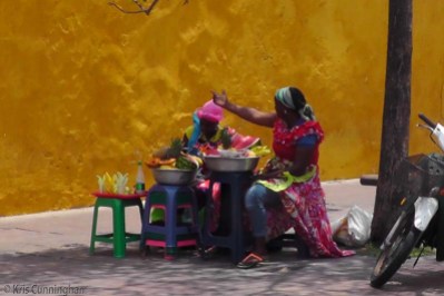 These colorful women were selling fruit at the entrance of the historical district.