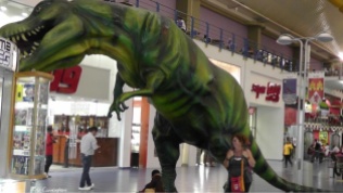 Holly looks small under the t-Rex. There is a Super 99 doorway there which gives no clue how big that store really is. It's like a super Walmart with groceries and pretty much anything else you can think of.