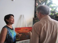 My friend Haydeé discuses a painting with Joel